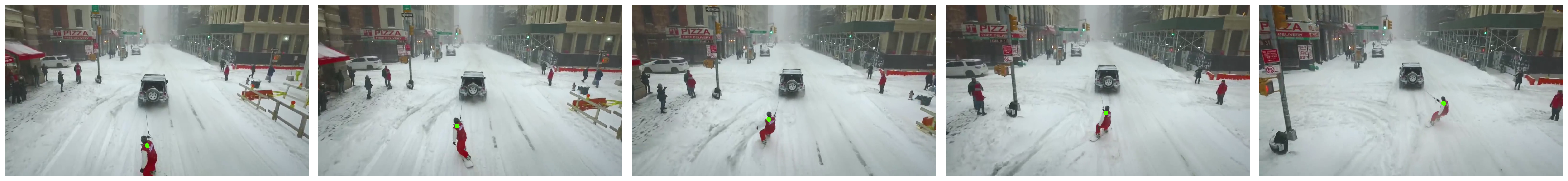 Snowboarder towed by a car